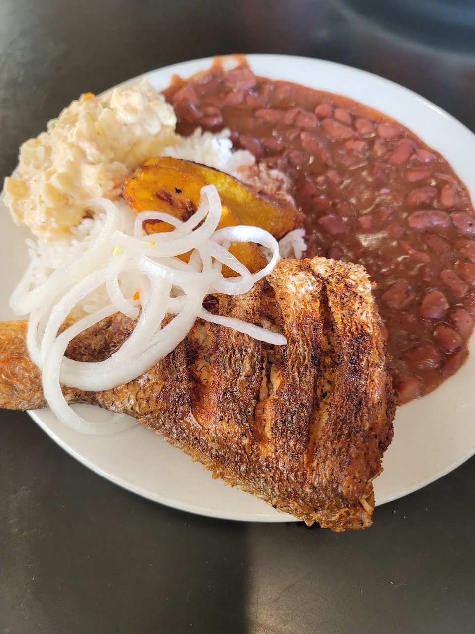 Printed menu with Central American dishes and beverages.
