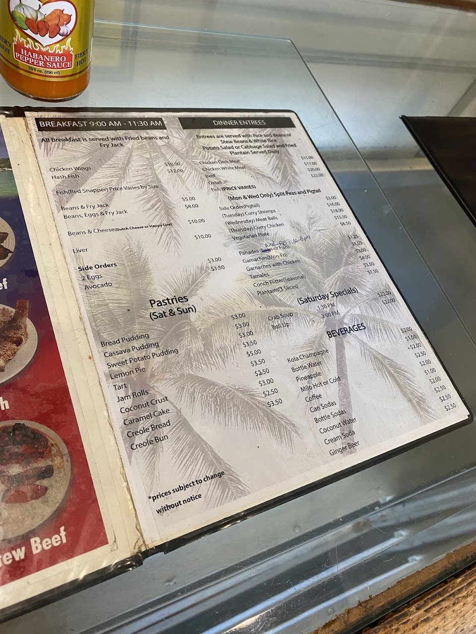 Printed menu with Central American dishes and beverages.